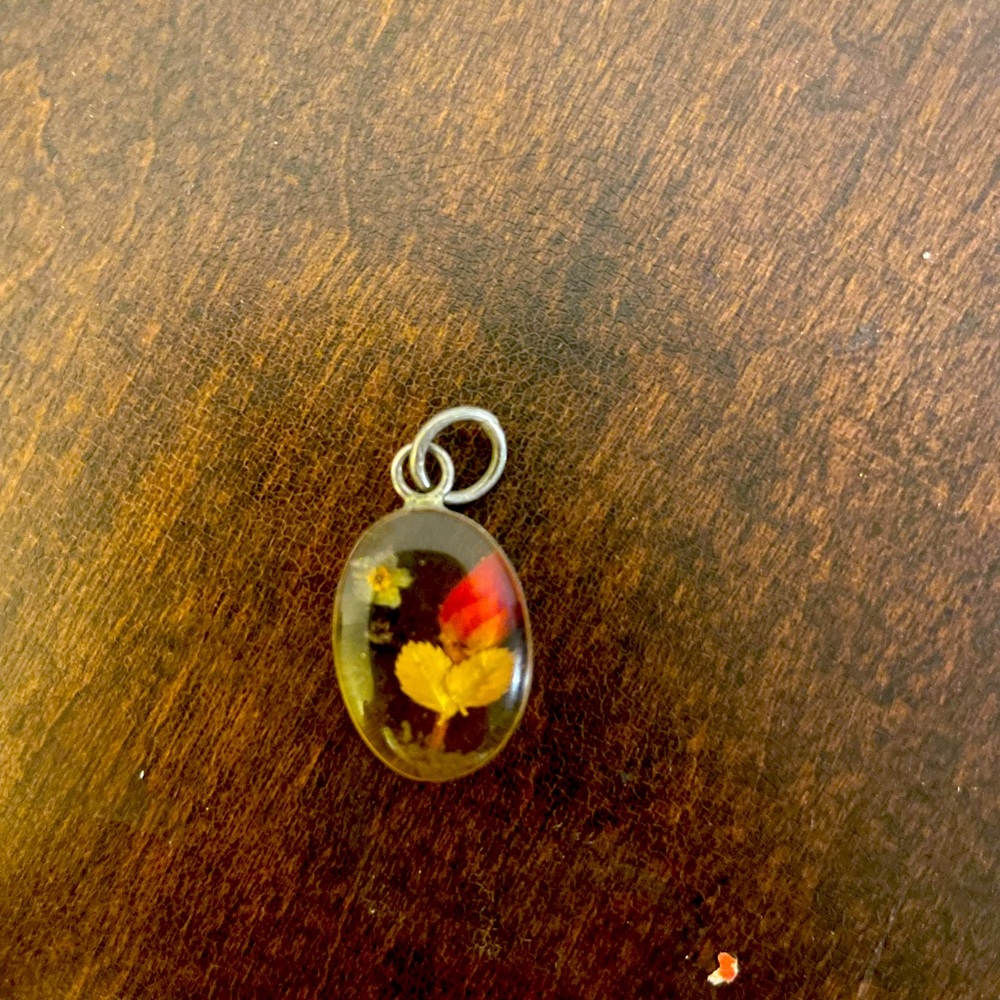 Vintage sterling silver and flowers set in lucite pendant